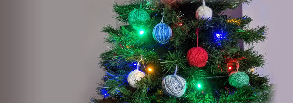 Christmas Tree with center-pull balls of yarn dangling from it